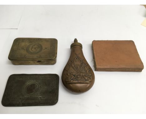 A copper powder flask embossed with regimental motif , a 1914 Christmas tin and Infantry training manual