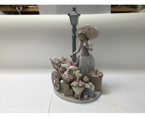 A Lladro figure of No. 6809 “Flowers for everyone”. Measuring approximately 40cm.