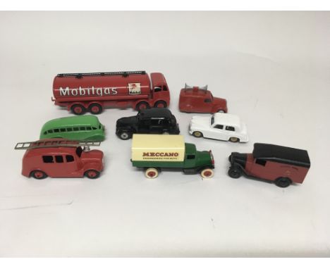 A collection of unboxed repainted Dinky Toys including a Meccano lorry, Mobilgas foden, a Fire engine No 995, a vanguard in m