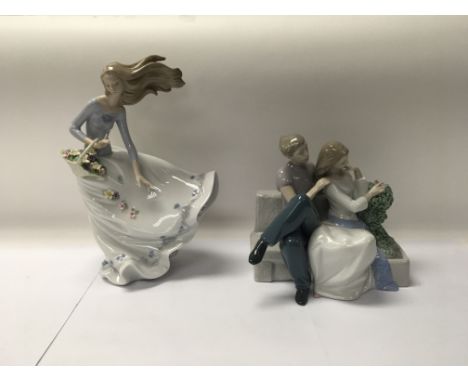 A pair of Lladro and Nao figures to include No. 6767 “Petals in the wind” and No. 1670 “The perfect couple”