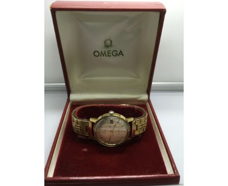 A gent's vintage Omega Seamaster watch with gold plated strap, in original box