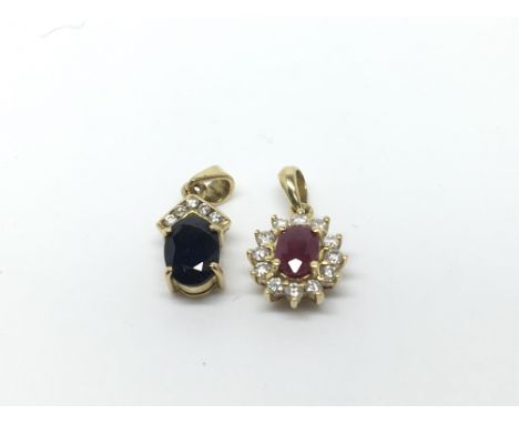 Two 18ct gold pendants, one diamond and sapphire amd one diamond and ruby. Total weight approx 2.6 grams.