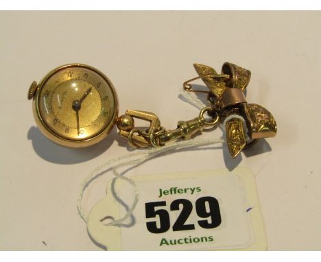 CONSOLE NURSES FOB WATCH with clip and ribbon pin, movement appears in working condition, crystal front and rear glass