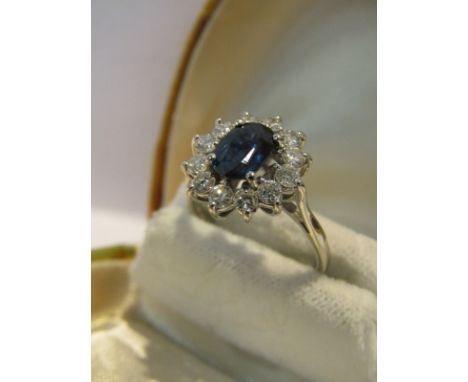 18ct WHITE GOLD SAPPHIRE & DIAMOND CLUSTER RING, central sapphire of good colour surrounded by 12 well matched brilliant cut 