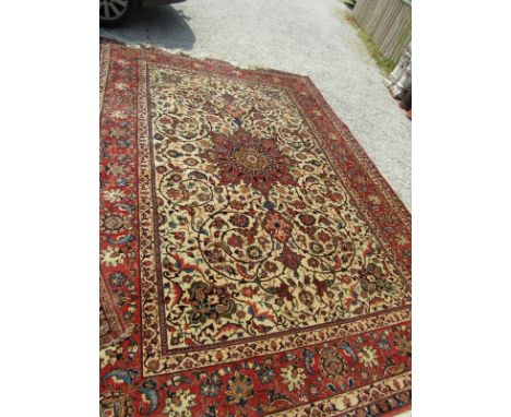 PERSIAN CARPET, a Tabriz central medallion cream ground multi bordered carpet, 137" x 95"