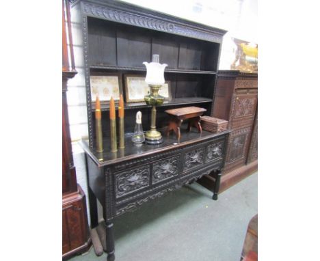 FLEMISH OAK DRESSER, 19th Century carved oak dresser with twin frieze drawers detailed with demon masks and open shelf back, 