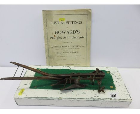 AGRICULTURE, a scale model of horse drawn plough together with related catalogue, 12" length  