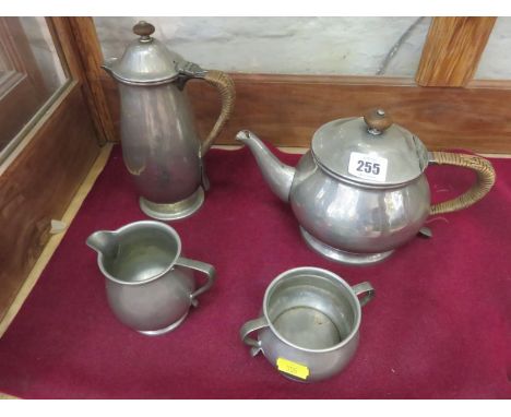 TUDRIC PEWTER, a Liberty 4 piece tea service with woven cane handle, pattern no. 1384