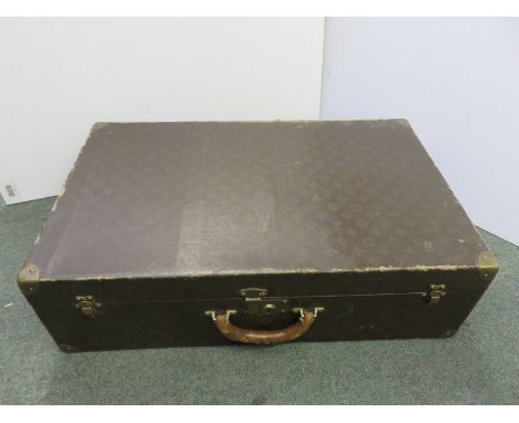 LOUIS VUITTON, a vintage suitcase initialed "N.F." 27.5" width 
