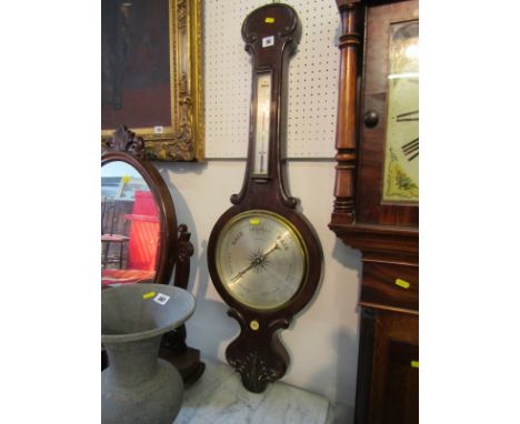 WHEEL BAROMETER/THERMOMETER, 19th century by C Freeman London, with steel face in a mahogany case 41"