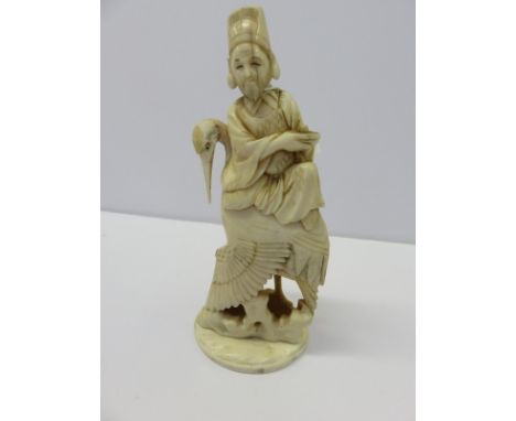 ANTIQUE IVORY, signed Japanese carved ivory figure group of deity of the back of a large stork, 6.5" high