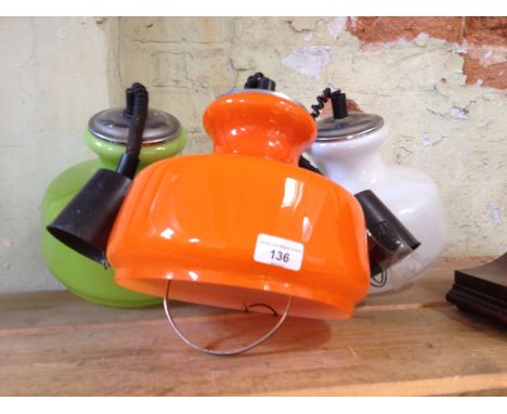 A group of three retro 1960/70s rise and fall ceiling light fittings.P&P:- No in-house p&p available on this lot. 