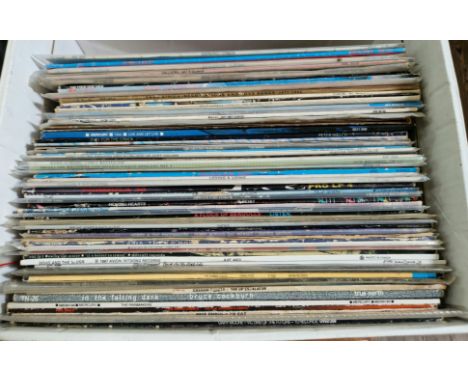 A box of approximately 63 vinyl LP records including The Velvet Underground, Michael Jackson, Paul McArtney, Spyro Gyro, Asia