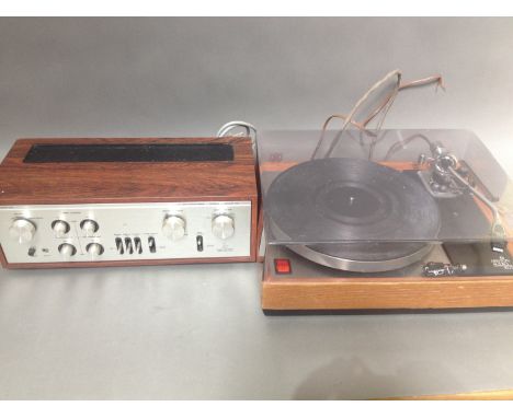 A Luxman L-30 amplifier and an Ariston Audio RD11 turntable.Condition:- General wear through age and use, untested, sold with