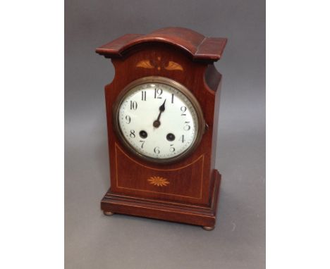 An Edwardian inlaid mahogany mantle clock, height 29cm.P&P:- No in-house p&p available on this lot.