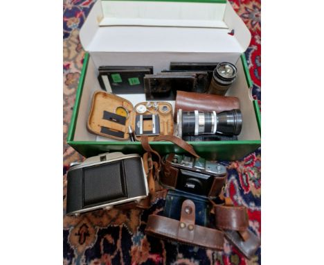 A box of cameras and accessories to include a vintage Taylor-Hobson Cooke Aviar Anastigmat No. 108065 6inch. Series II lens w