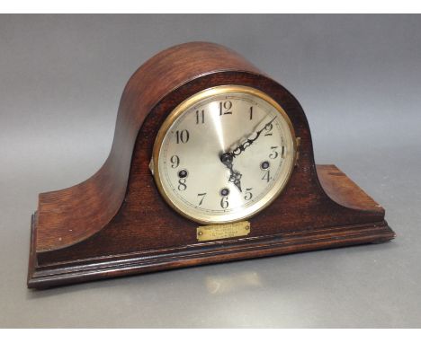A Westminster chime domed oak mantle clock with presentation plaque in Welsh, length 43cm.P&P:- No in-house p&p available on 