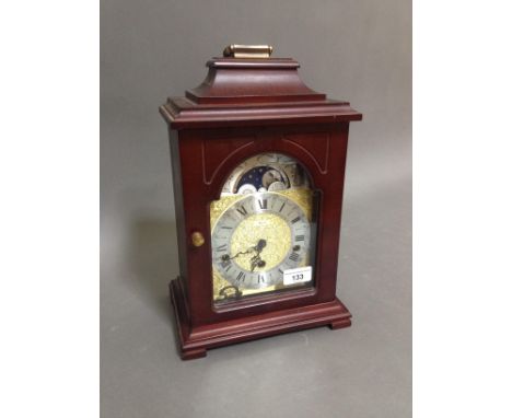 A Hermle mahogany cased mantle clock with moon phase dial, height 35cm.P&P:- No in-house p&p available on this lot. 