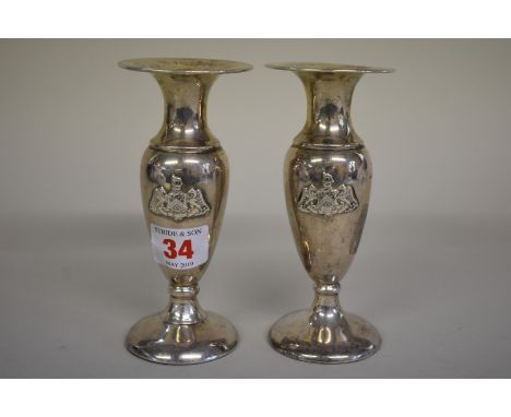 A pair of silver crested baluster vases,Â&nbsp;byÂ&nbsp;R &amp; S Garrard &amp; Co, London 1911, 14cm, weighted. 