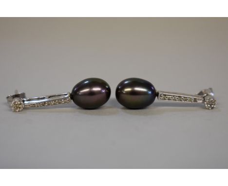 A pair of black pearl and diamond unmarked pendant ear studs. 
