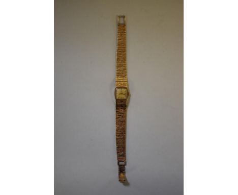 An Omega 9ct gold ladies manual wind bracelet watch, cal 485, serial number 28632255, 26g. 