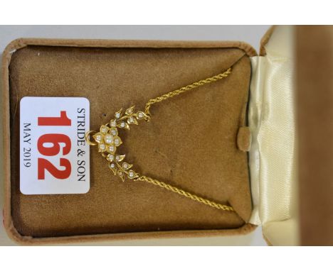 An unmarked yellow metal pearl 'floral garland' necklace. 