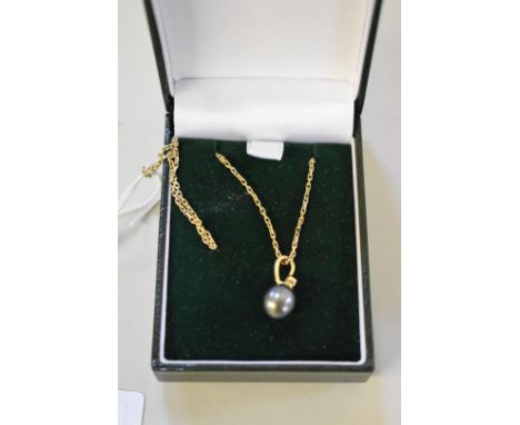 A black pearl and diamond gold pendant,&nbsp;stamped 18k; together with a gold neck chain stamped 9k 