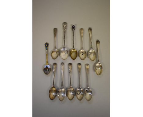 Eleven silver teaspoons, 125g all in; together with an Italian 800 silver gilt and enamel souvenir teaspoon. 