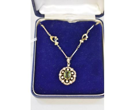 An Edwardian pearl and peridot gold necklace, the pendant stamped 9ct. 