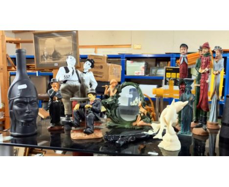 A selection of resin &amp; ceramic figures including Laurel &amp; Hardy etc. 
