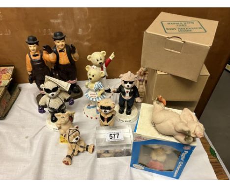 A quantity of resin figures including moles, bears, pigs & A Laura & Hardy ceramic