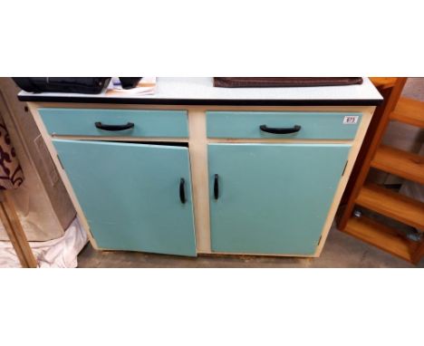 A vintage kitchen cupboard unit with Formica top