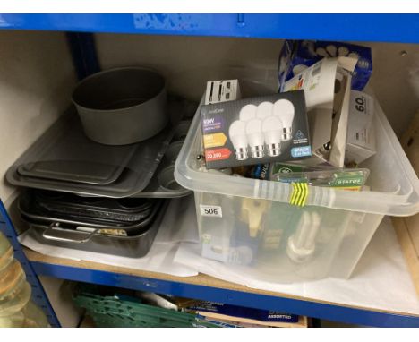 A selection of baking trays mostly new &amp; A box of light bulbs 