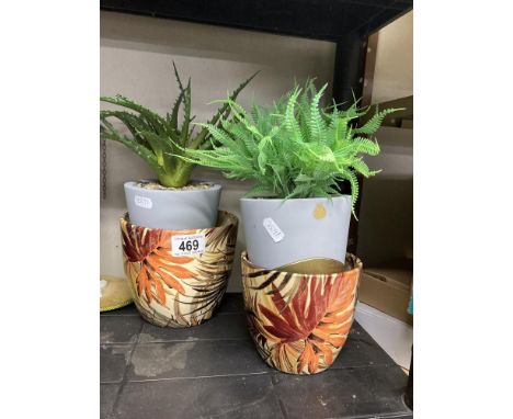 A faux Aloe Vera plant in pot a ceramic plant pot &amp; one other 