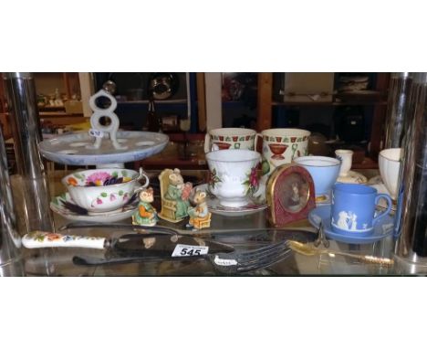 A shelf of various ceramic figures & An egg tray 
