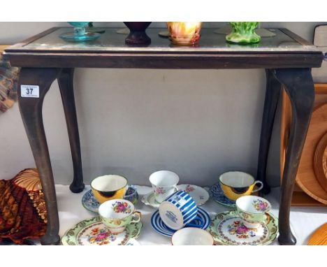 A dark wood side table with carved top under glass COLLECT ONLY 