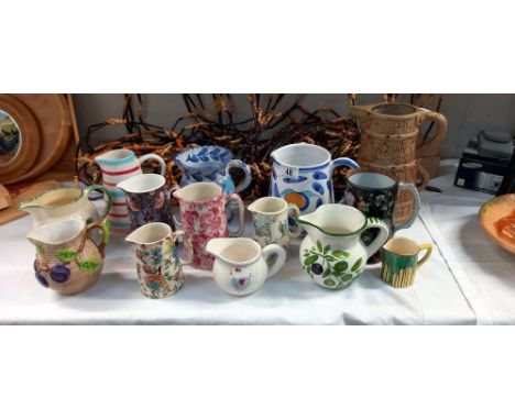 A good lot of decorative jugs including Mason Cash &amp; Poole pottery etc 