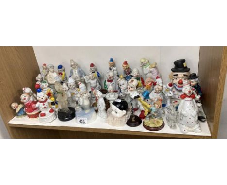 2 shelves of over 60 ceramic and other materials (resib etc) Clowns 