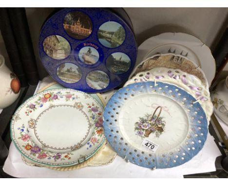 A collection of hanging wall plates &amp; blue tin 