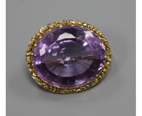 An early 20th century yellow metal mounted oval amethyst brooch, 26mm.ex Congelow House