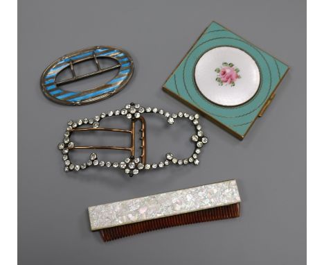 A silver and enamel buckle, a paste buckle, comb and compact.