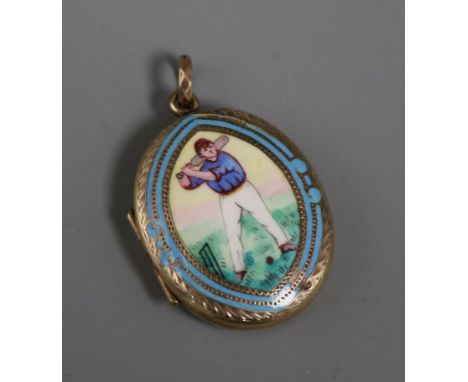 A late Victorian engraved yellow metal and enamel oval locket, decorated with a cricketer, 32mm.