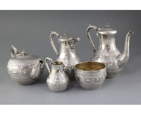 A good Victorian five piece silver tea and coffee service by Frederick Elkington, with engraved crest and decorated and embos