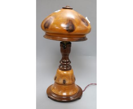 A fruitwood lamp, on circular foot, with vari baluster stem and domed wood shade, overall height 45cmex Congelow House