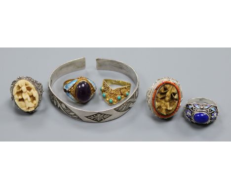 Five assorted white metal and gem set "Peking" rings including amethyst and ivory and a Chinese white metal bracelet.