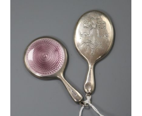 Two silver mounted handbag mirrors including one with pink guilloche enamel, largest 73mm.