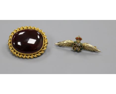 A Victorian yellow metal and cabochon garnet set oval brooch and a later 9ct gold and enamel sweethearts brooch, garnet brooc