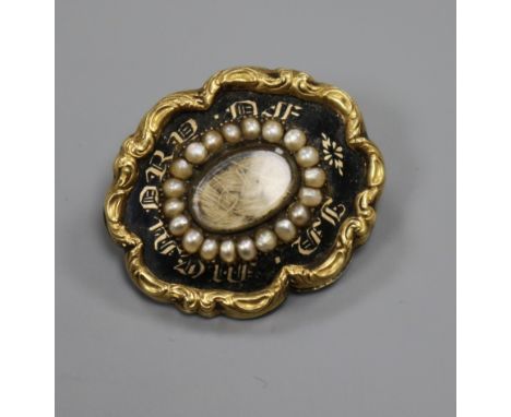 An early Victorian yellow metal, black enamel and seed pearl set mourning brooch, 26mm.