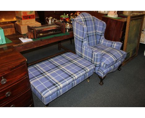A wing back armchair with blue check upholstery and cushion, on carved cabriole front legs with ball and claw feet, together 