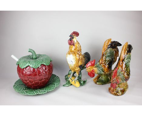 A majolica pottery cockerel standing on an ear of corn, two similar chickens and an unusual majolica soup tureen modelled as 